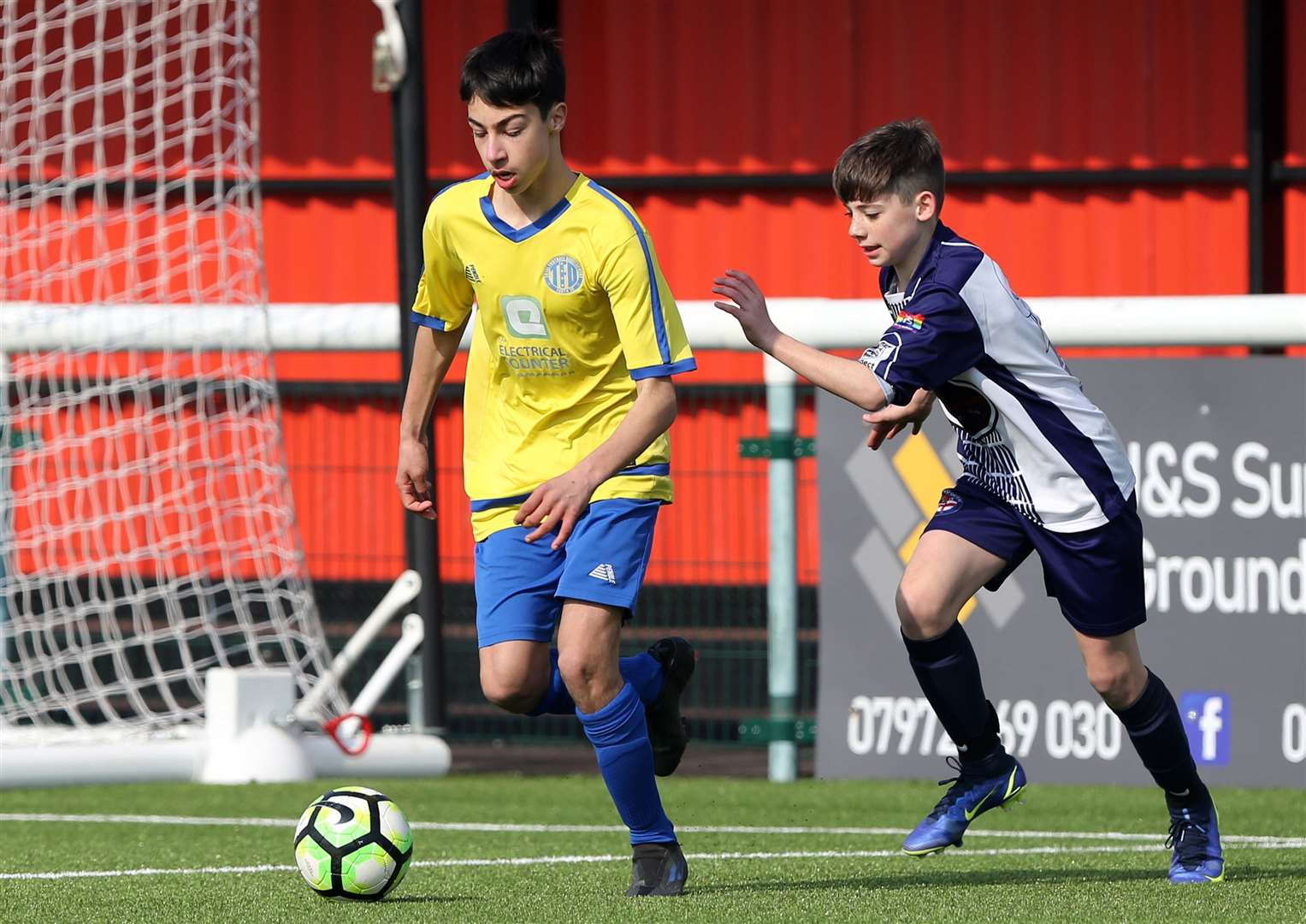 Total Football Development under-13s (yellow) look to bring the ball out of defence. Picture: PSP Images (55560619)