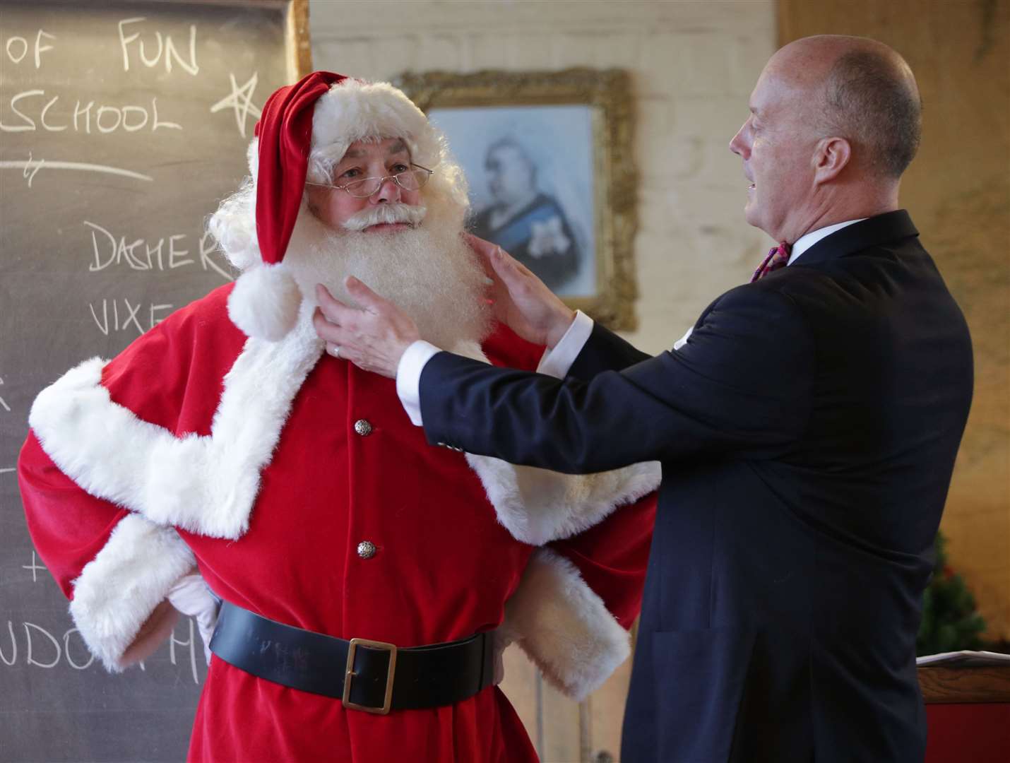 Ministry of Fun director James Lovell teaching a classroom of elves and Father Christmas performers (Yui Mok/PA)