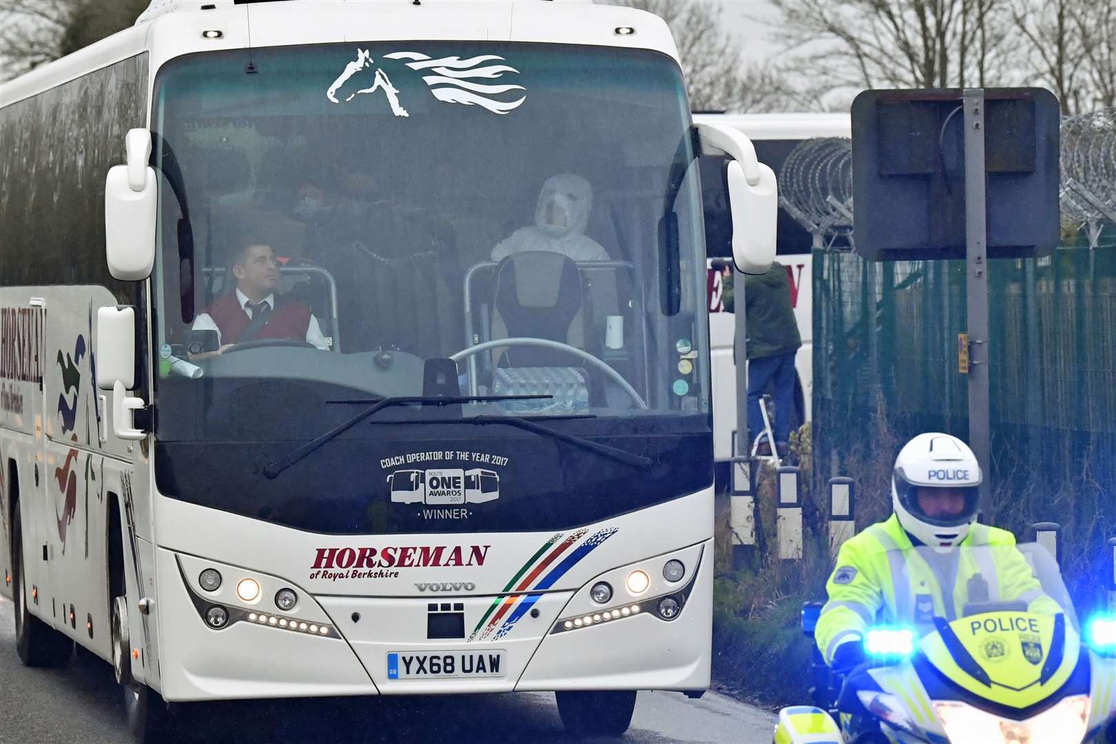 A convoy leaves Brize Norton in Oxfordshire, carrying passengers from a plane which transported British nationals from Wuhan in China (Ben Birchall/PA)