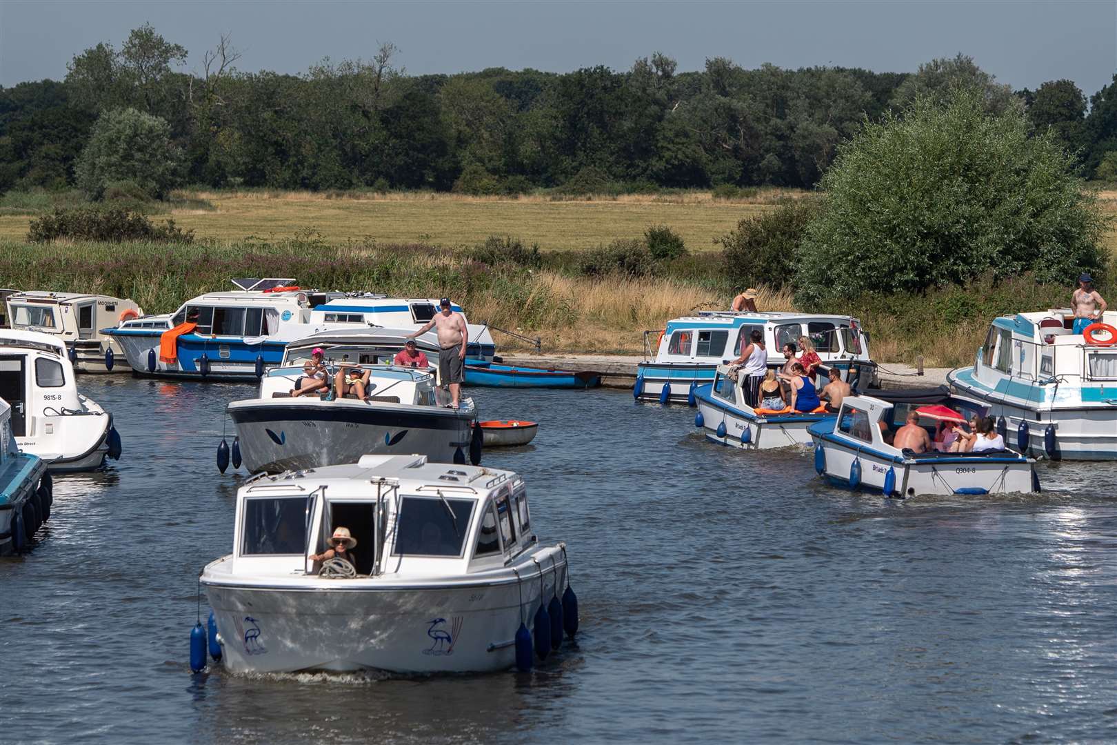 Pleasure boats make their way along the River Ant at Ludham Bridge on the Norfolk Broads (Joe Giddens/PA)