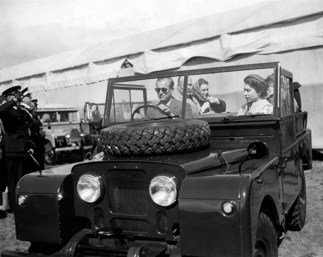 Philip takes the wheel of a Land Rover to drive the Queen around her inspection of the jumps in the European Horse Trials (PA)