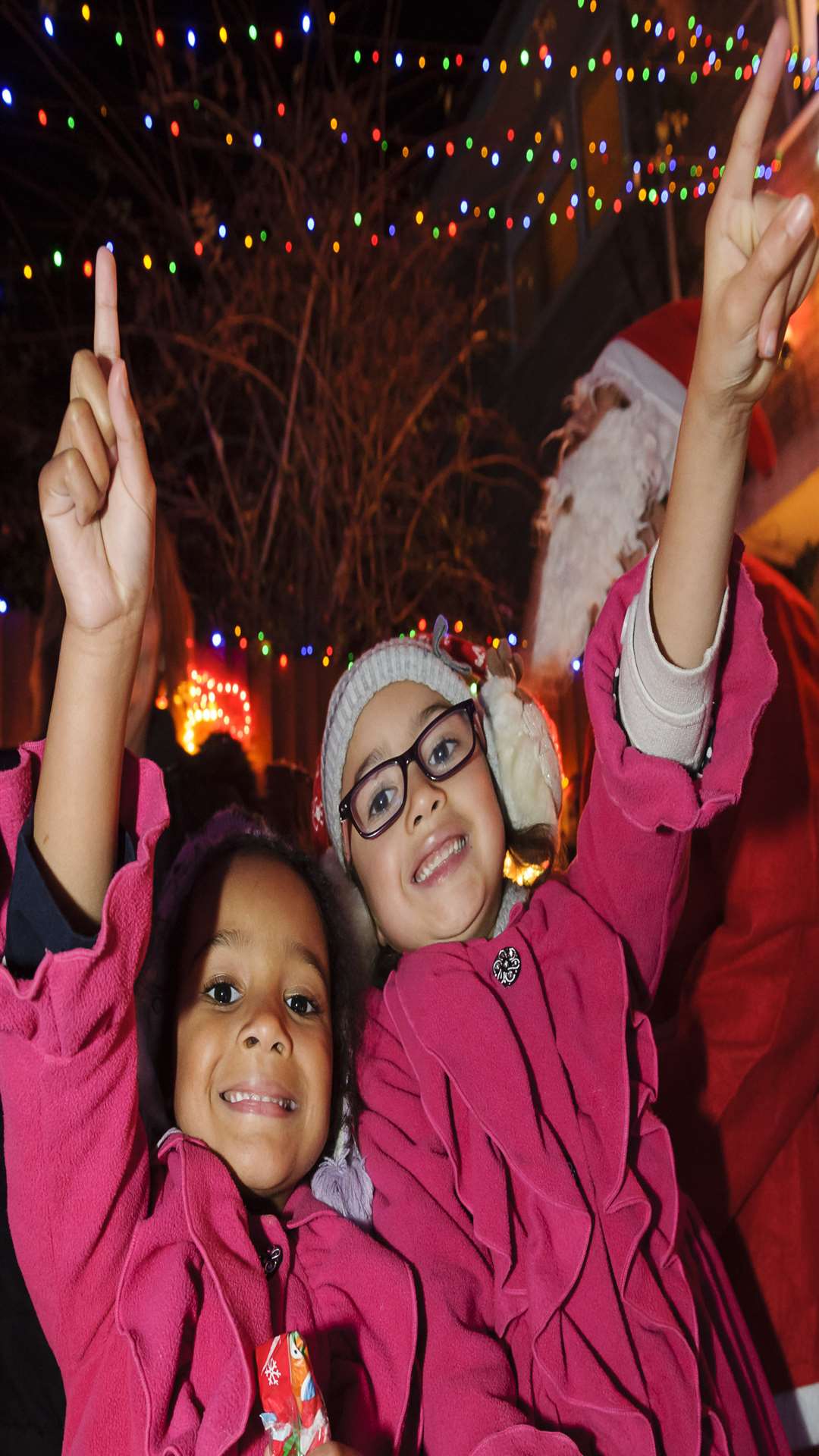 Connie Fry, 5, and Florence Fry, 6, look at the lights.