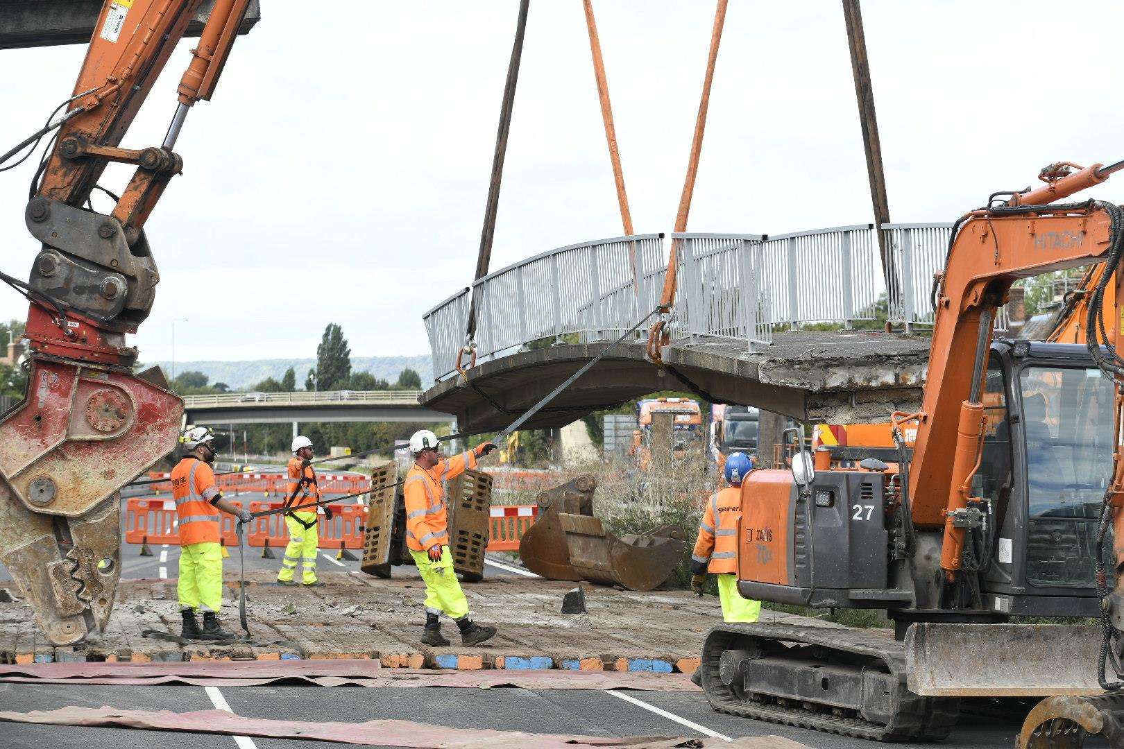 Contractors demolishing the Teapot Lane footbridge. Picture: Kier Group