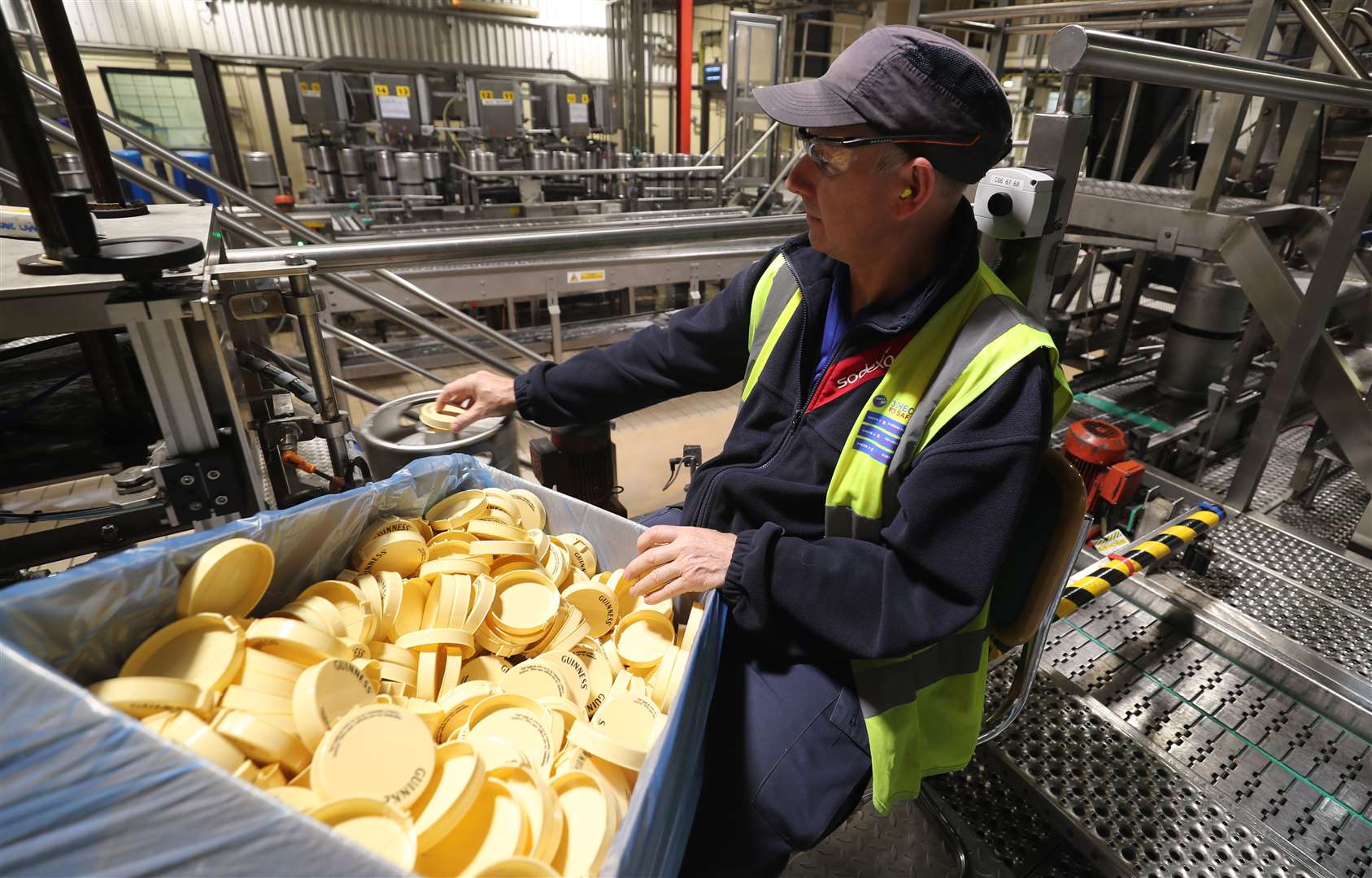 A worker places lids on 20 Litre Kegs of Guinness at the St James’s Gate Guinness brewery in Dublin (Niall Carson/PA)