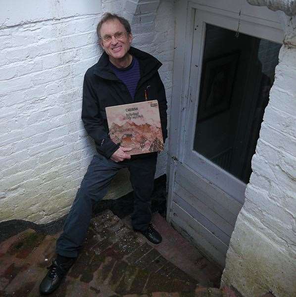 Dave Sinclair with the iconic album In the Land of Grey and Pink outside the basement flat where he created his early music for Caravan