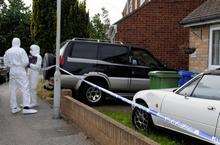 Police Forensic Investigators at the scene of a murder on Oak Road, Murston on Saturday, June 6.