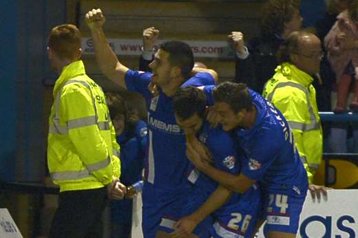 Harry Lennon, No.26, is mobbed after his last-gasp winner against Scunthorpe Picture: Barry Goodwin