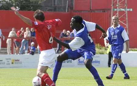 GETTING STUCK IN: both sides showed commitment in the tackle, despite it being a friendly. Picture: PAUL DENNIS