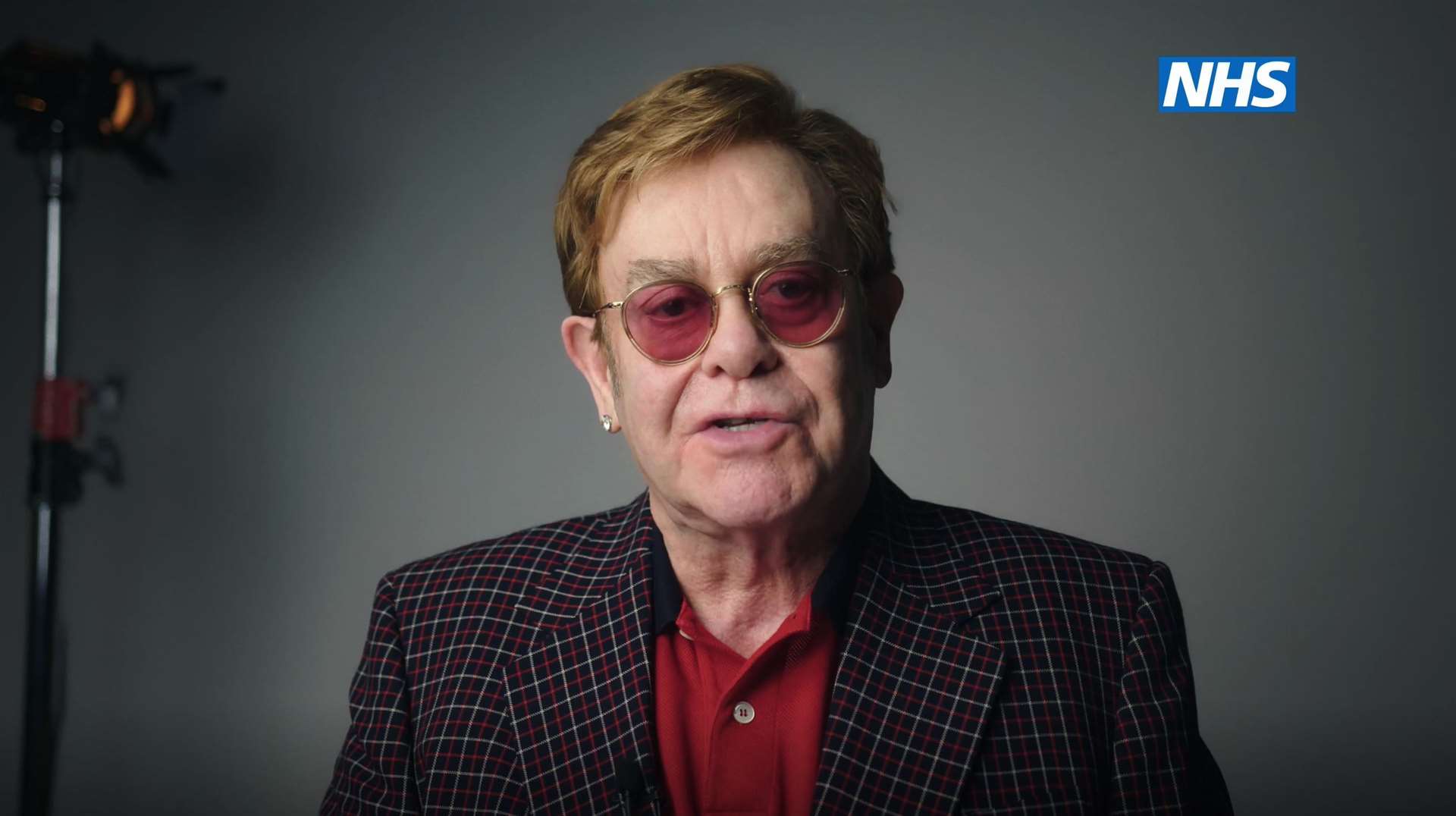 Sir Elton John as he stars, with Sir Michael Caine, in the new video to encourage people to get vaccinated against coronavirus (NHS England/PA)