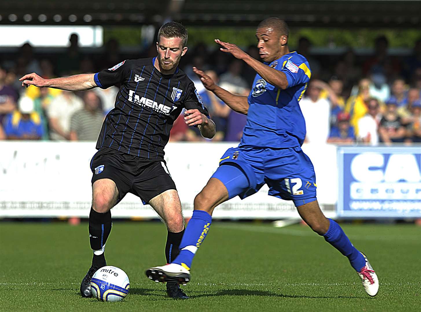 Christian Jolley gets stuck into Gillingham during his AFC Wimbledon days. Picture: Barry Goodwin