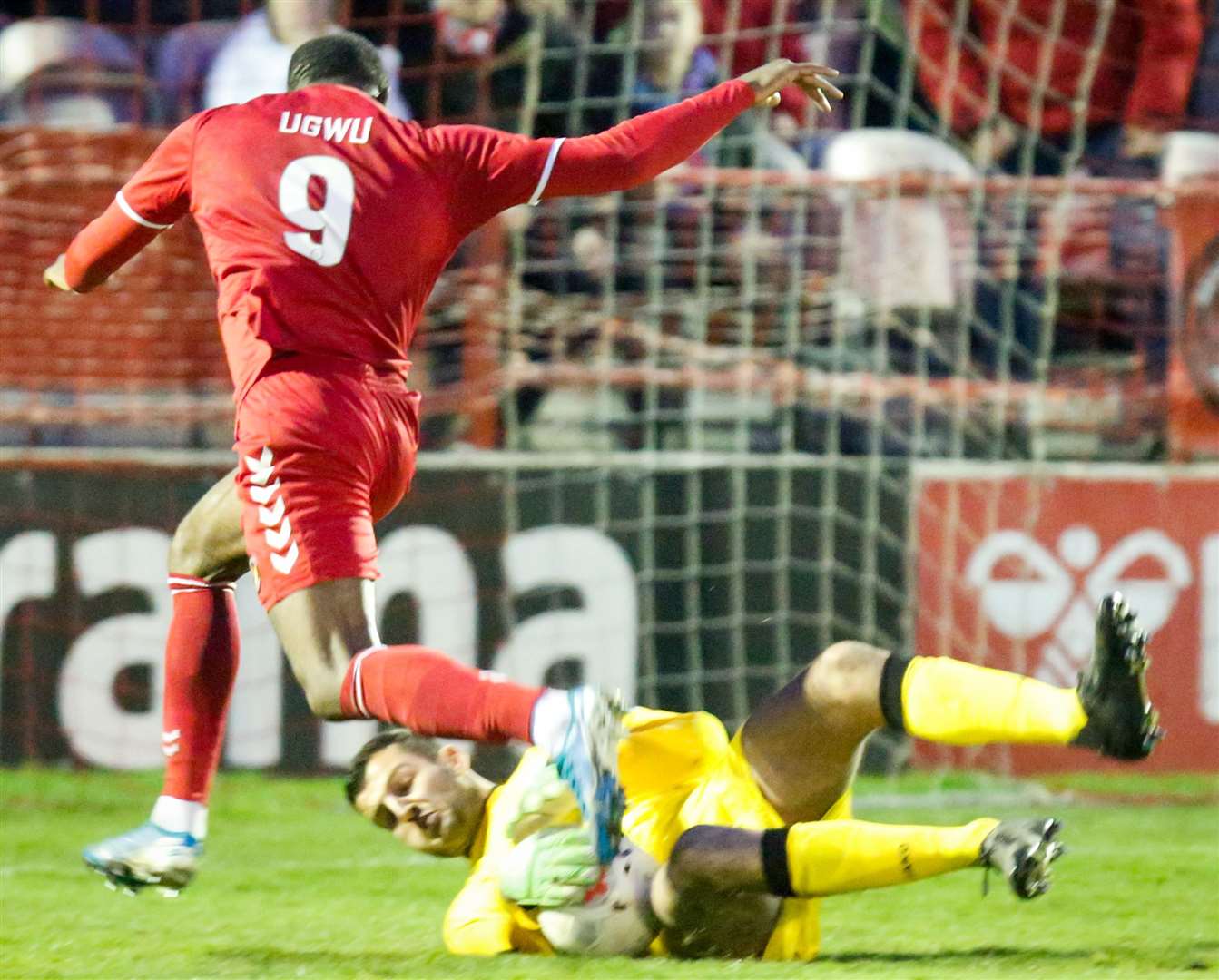 Dover keeper Yusuf Mersin gets down well to save from Fleet's Gozie Ugwu. Picture: Matthew Walker FM25363155