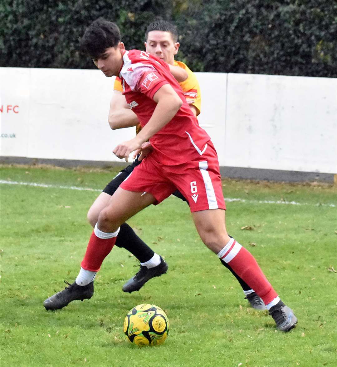 Hythe defender Louie Procopi holds off his man against Littlehampton. Picture: Randolph File