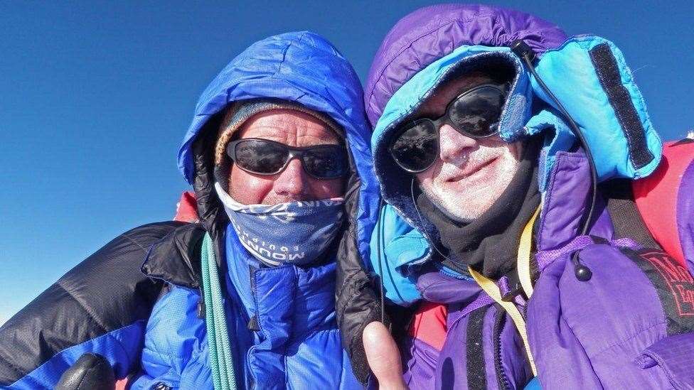 Rick Allen with former climbing partner Sandy Allan on the Mazeno ridge in Pakistan at the summit of Nanga Parbat in the far distance (Sandy Allan/PA)