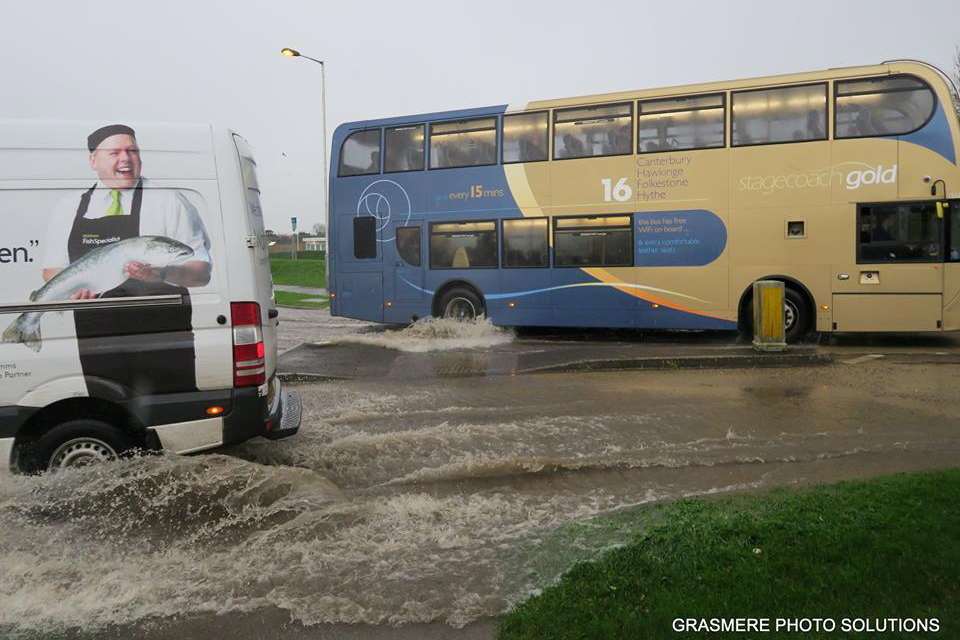 The flooding in Hawkinge. A remarkable moment when a van with an image of a man with a fish passes the scene. Picture: Grasmere Photo Solutions.