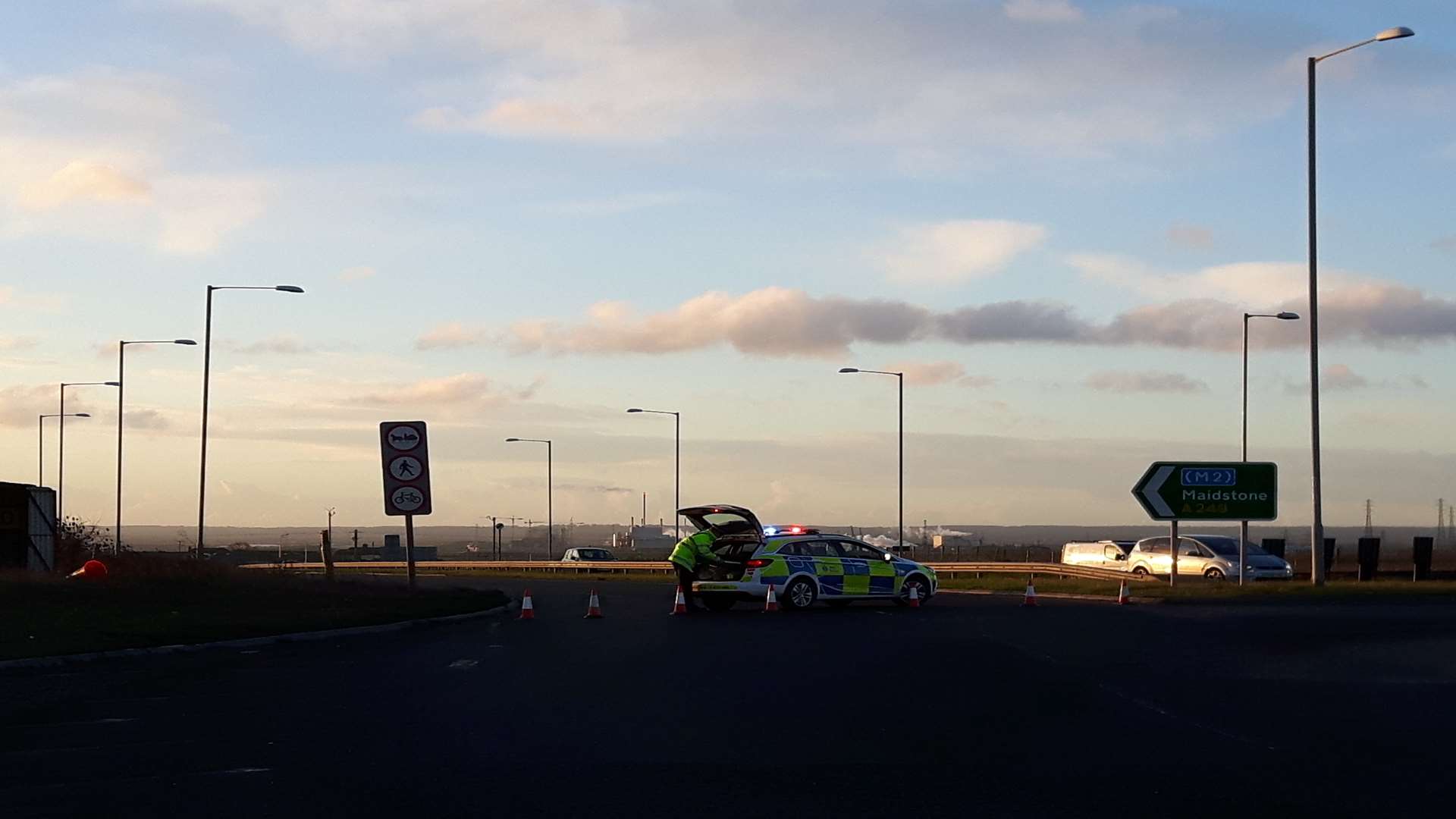 A policeman cones off the Sheppey Crossing