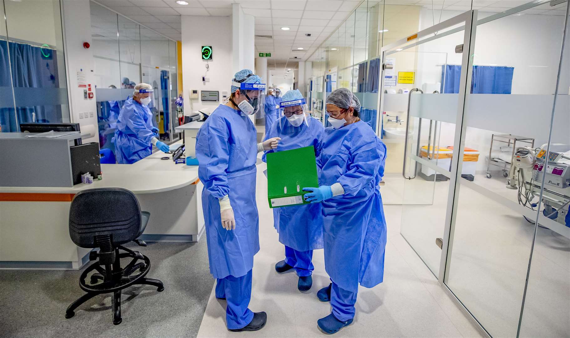 Health workers wearing full personal protective equipment (PPE) on the intensive care unit (ICU) at Whiston Hospital in Merseyside (Peter Byrne/PA)