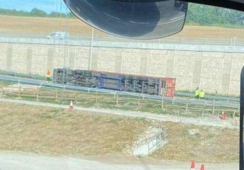 The lorry on its side on the slip road to the A249 off the Stockbury Roundabout, near Sittingbourne. Picture: Tony Atkinson