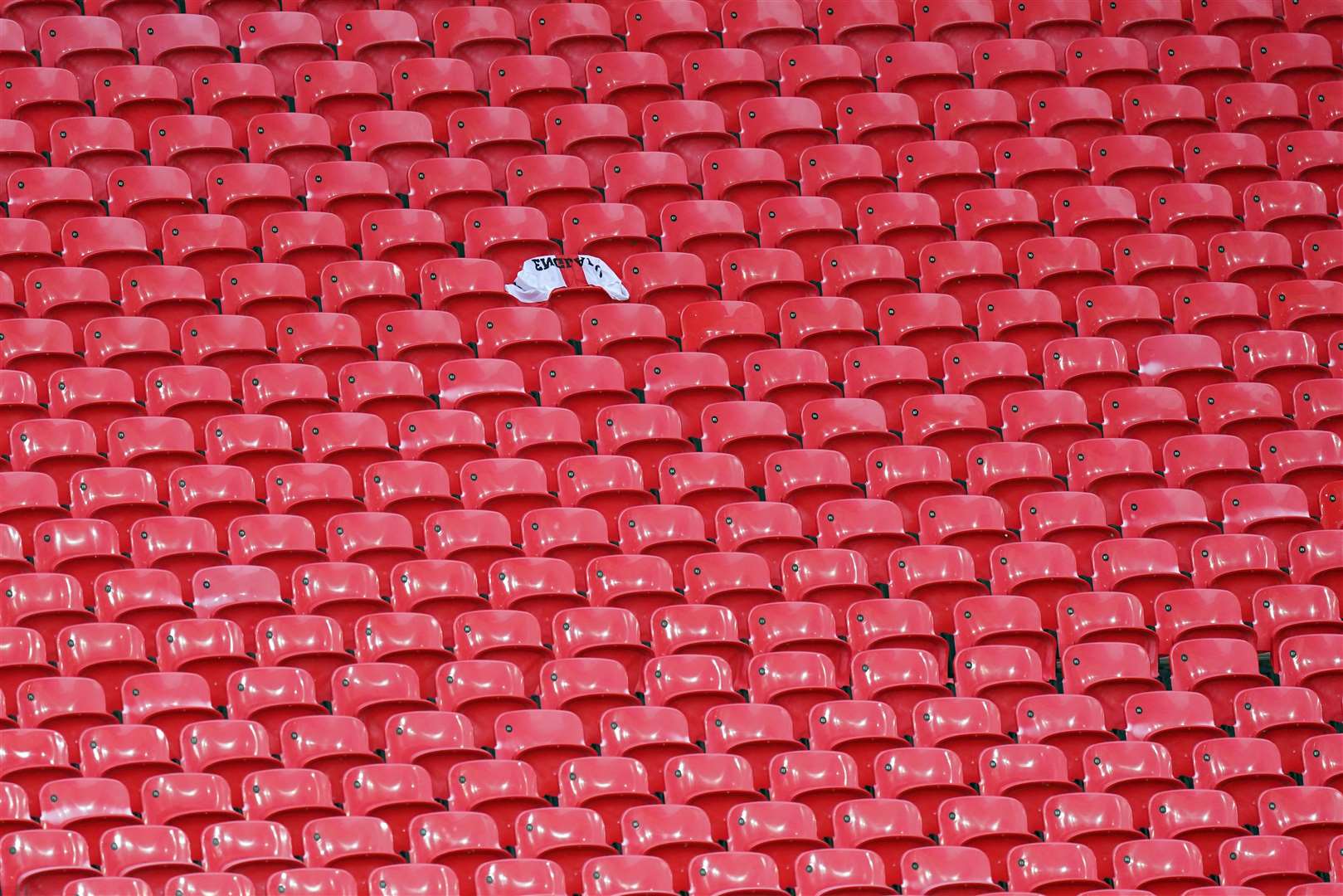 An England flag surrounded by empty seats was among the first supporters inside Wembley (Mike Egerton/PA)