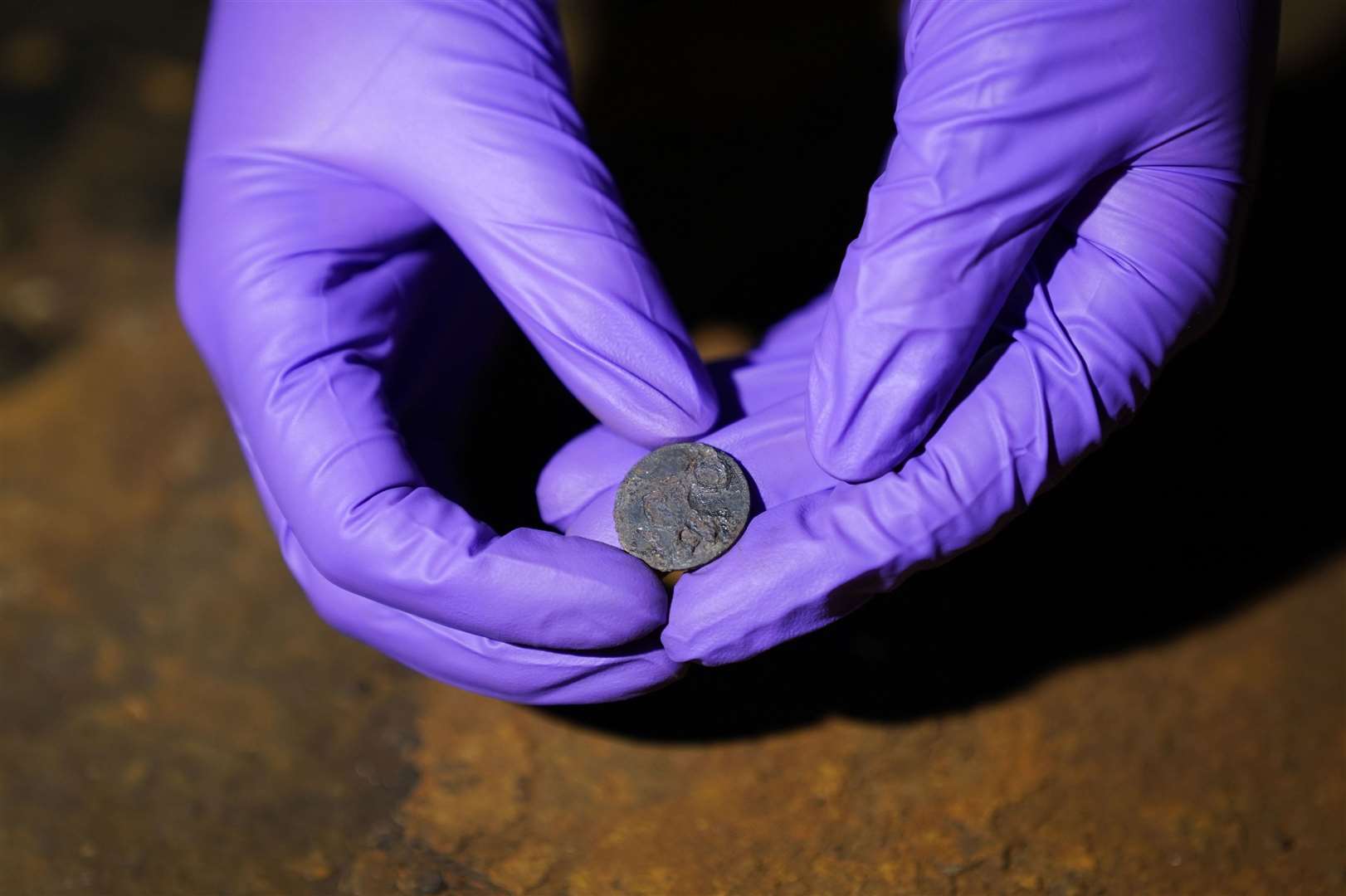 The coin was found next to a metal wedge placed between the mast and the base plate (Andrew Matthews/PA)