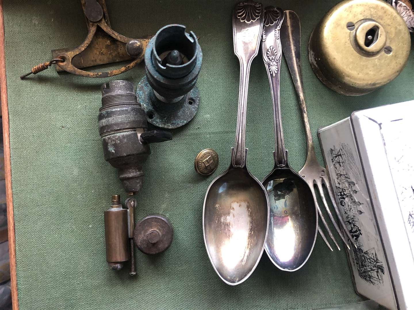 Items including old electric fittings, spoons and a cigarette lighter