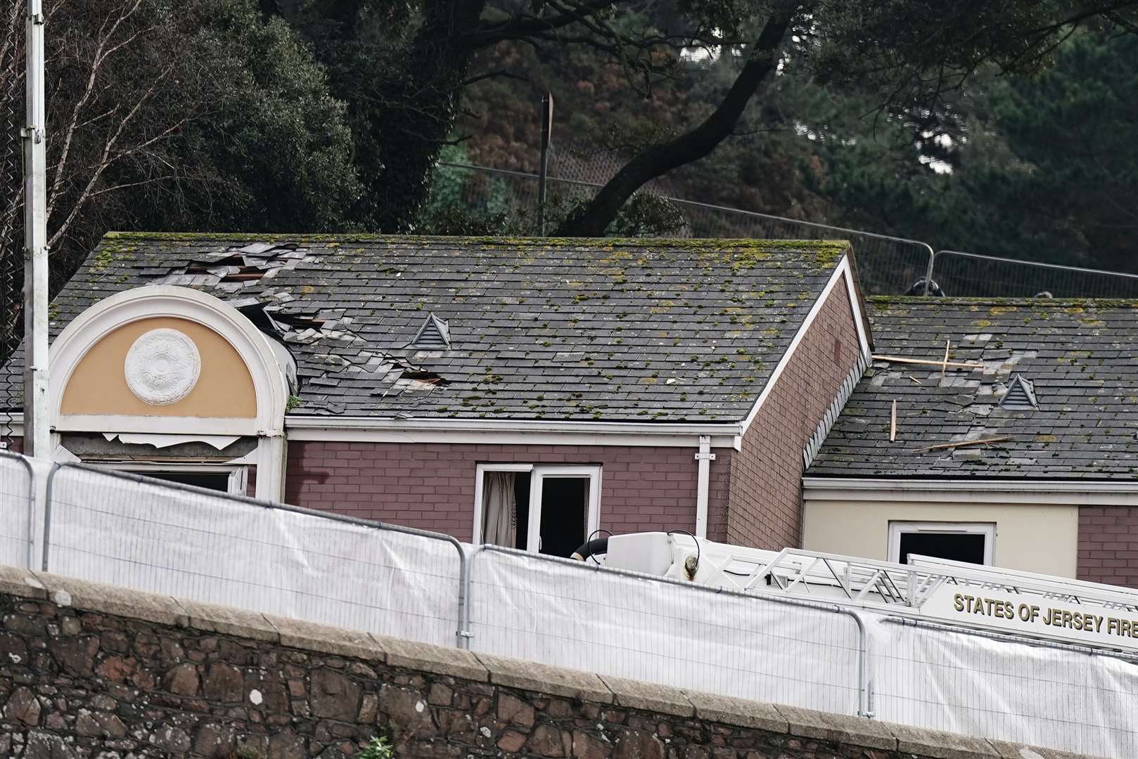 A damaged property next to the scene of the explosion (Aaron Chown/PA)