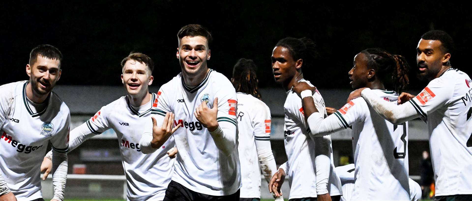 Dover’s players celebrate their matchwinning third goal in their 3-2 Isthmian Premier victory against Canvey Island on Saturday. Picture: Barry Goodwin