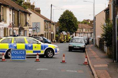 Police block off Chalkwell Road, Sittingbourne, after a man died in a scaffolding collapse.