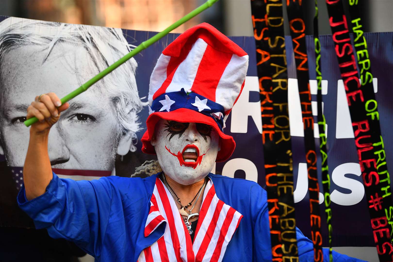 A supporter of Julian Assange protests outside the Old Bailey (Victoria Jones/PA)