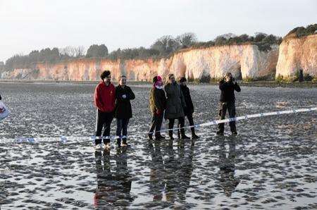 Crowd gathers to see the whale washed up at Pegwell Bay