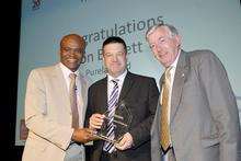 Jon Barrett of Lenham-based Purelabs, winner of the 2009 Kent Innovation Challenge, with Kriss Akabusi, left, and Tim Bentley, chairman, at the Kent 2020 Vision gala dinner presentation