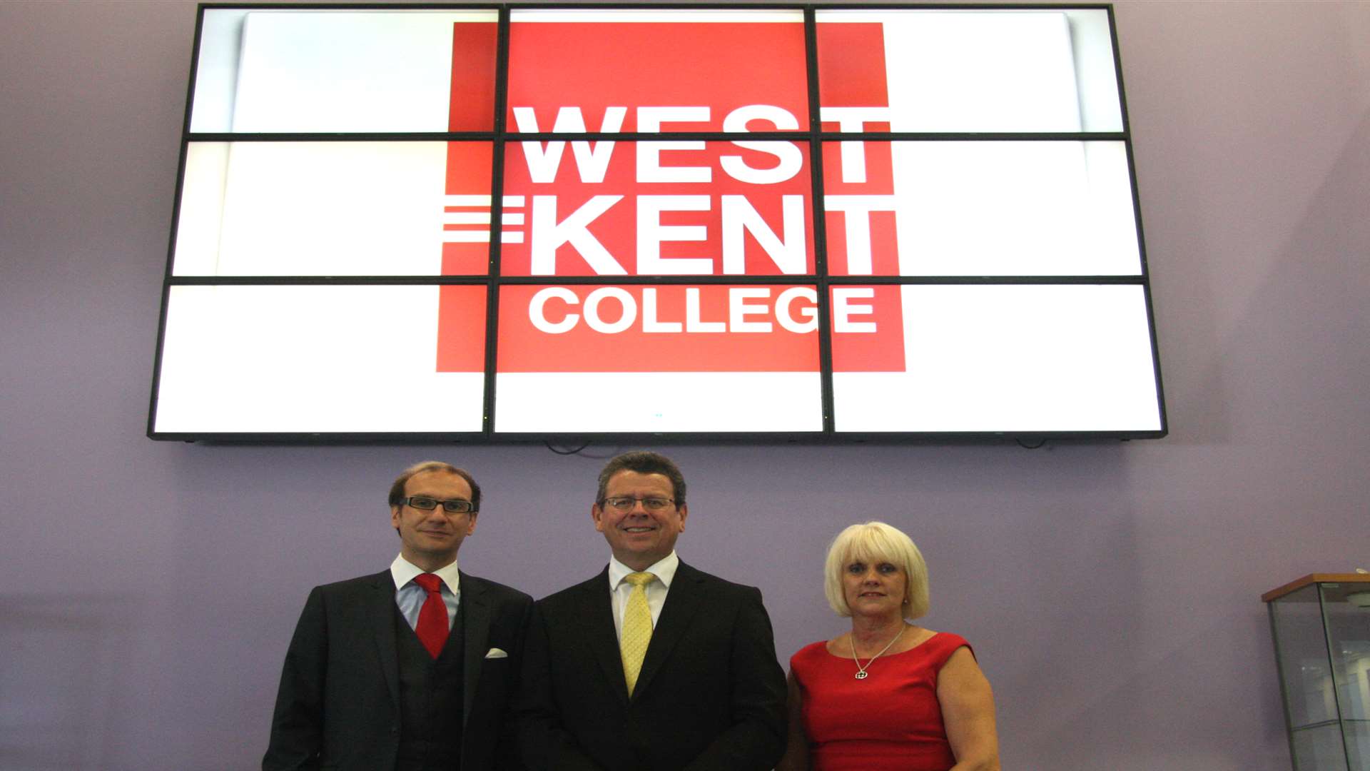 Hadlow College finance director Mark Lumsdon-Taylor, left, principal Paul Hannan and vice principal Lynda Brown with the new West Kent College branding