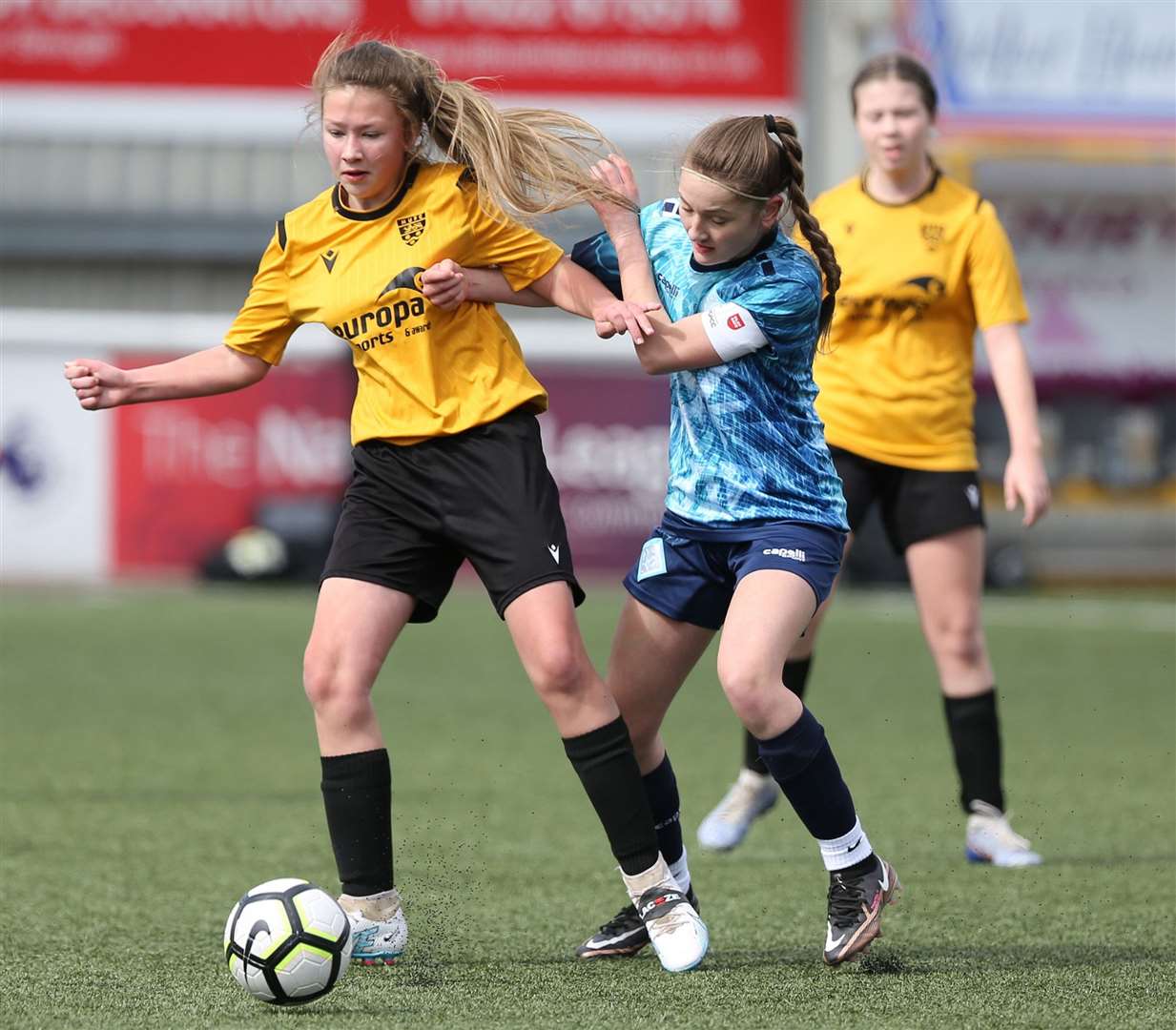 No quarter given as Maidstone United and London City Lionesses battle for possession in the Kent Merit Under-14 Girls Cup Final. Picture: PSP Images