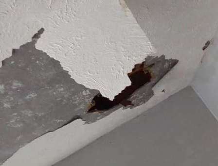 Hole in the ceiling from the leak in Hollingbourne Road, Twydall. Picture: Marley Simmons