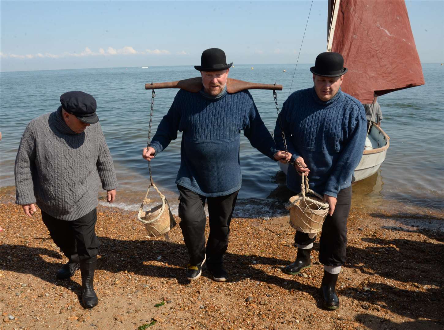 The Landing of the Oysters, Lee Sully, Neil Austin and Mike Keam bring the oysters ashore during the Whitstable Oyster Festival on Saturday. Picture: Chris Davey... (3192534)