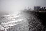 The waves crash against the seawall which is about to be reinforced