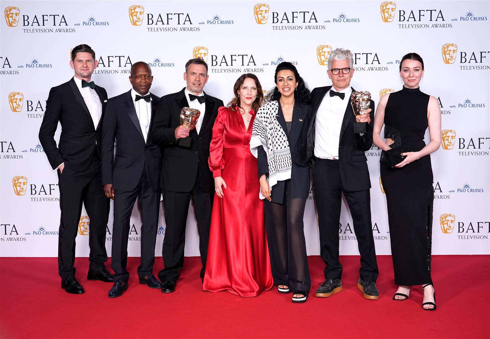 Charles Steel, Gerry Jackson, Alasdair Flind, Tina Pawlik, Myriam Raja and Alice Pearse after winning the drama series award for Top Boy at the Bafta TV Awards 2024 (Ian West/PA)