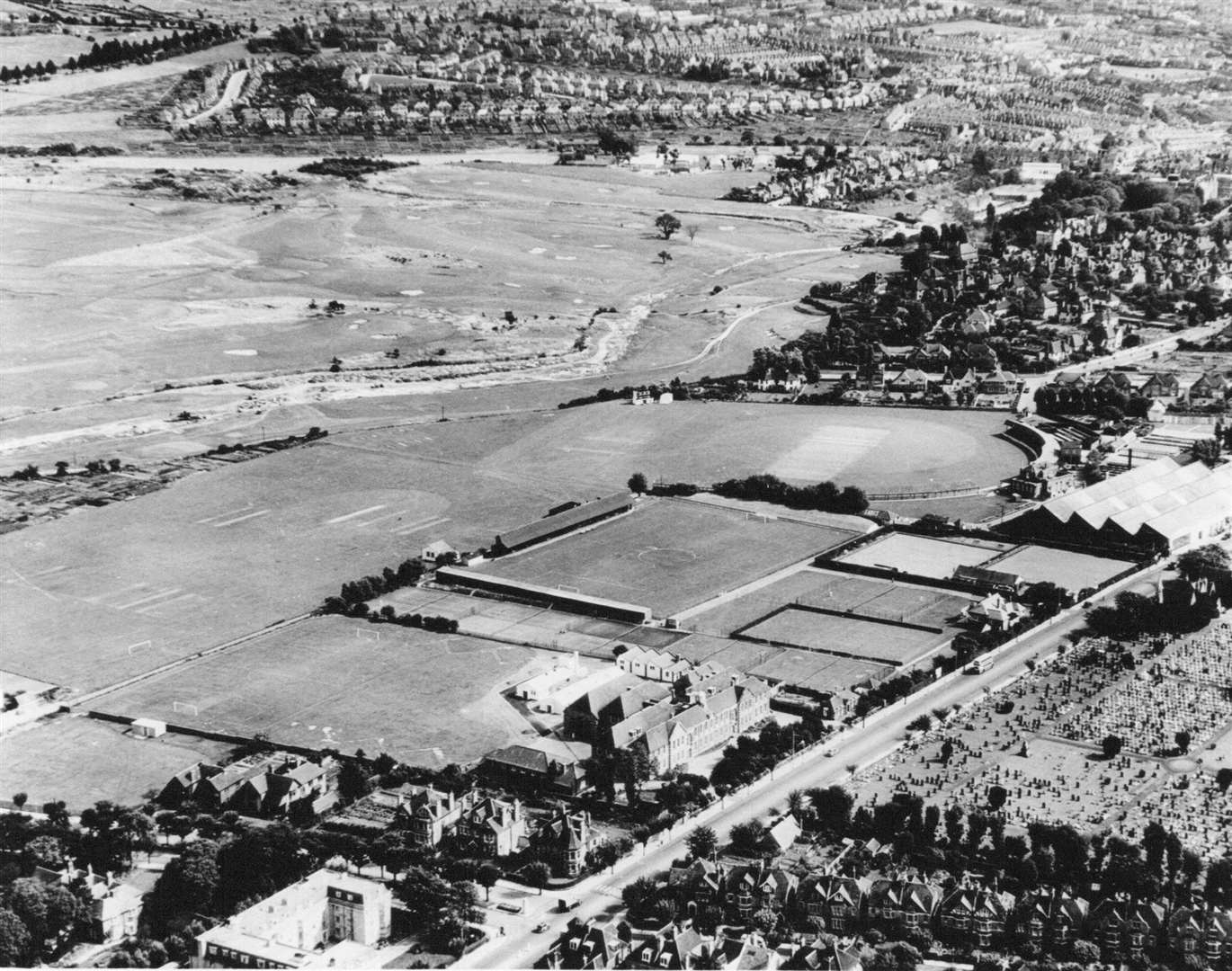 Cheriton Road, showing the Harvey Grammar School, Sports Grounds and Golf Course