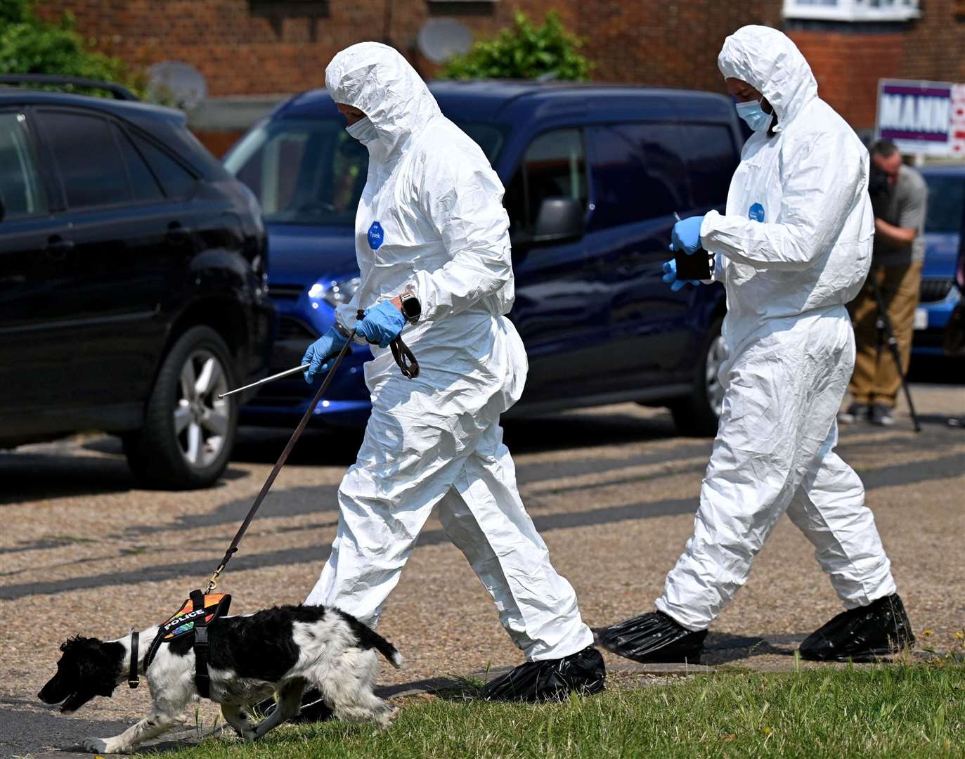 Forensics pictured in Mooring Road, Rochester, where a motorbike believed to be connected to the stabbing was found last night. Picture SWNS