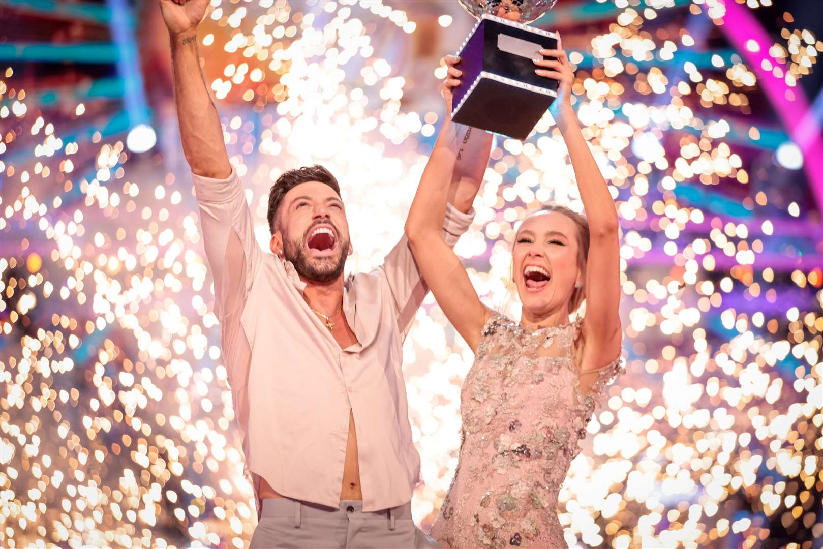 Rose Ayling-Ellis and Giovanni Pernice with the glitterball trophy during the final of Strictly Come Dancing 2021 (Guy Levy/BBC/PA)