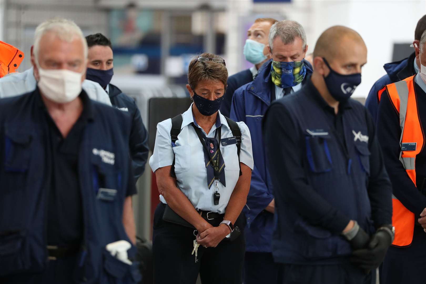 Rail staff fall silent at Glasgow Queen Street station (Andrew Milligan/PA)