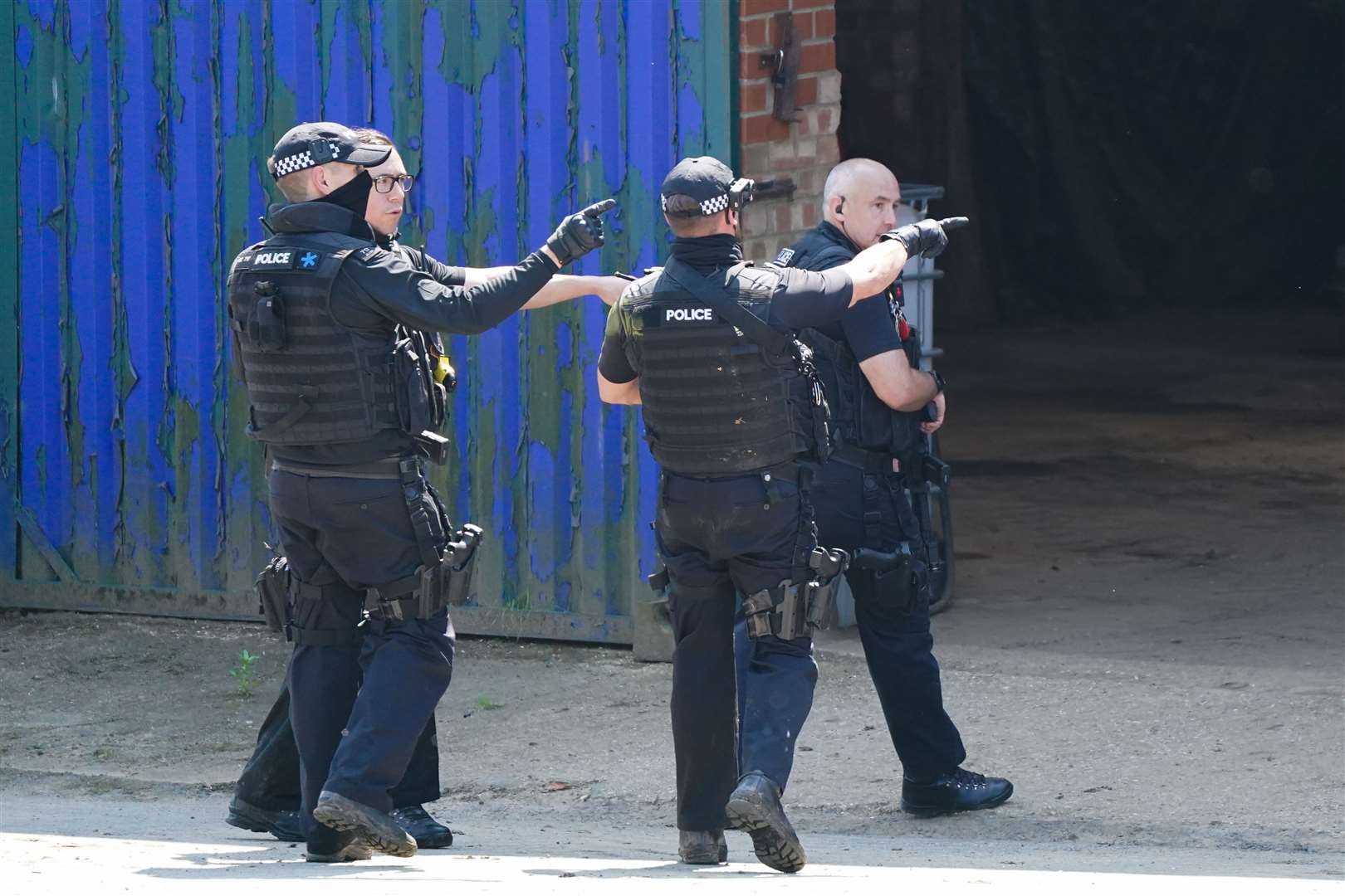 Armed police at the farm on the outskirts of Louth, Lincolnshire (Joe Giddens/PA)