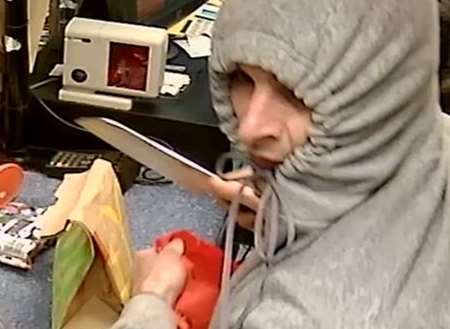 CCTV of the raid shows Harris with a knife. Picture: Kent Police.