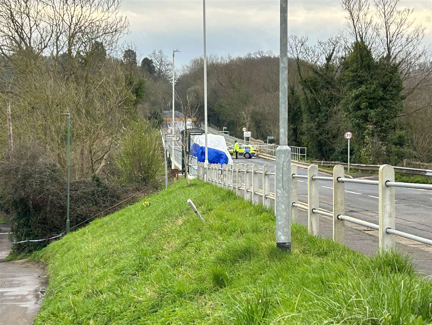 A white tent was erected near a bus stop in the village following the stabbing in March