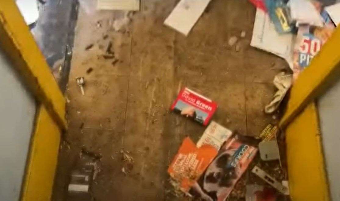 Leaflets and letters scattered by the front door. Picture: Clive Emson / YouTube