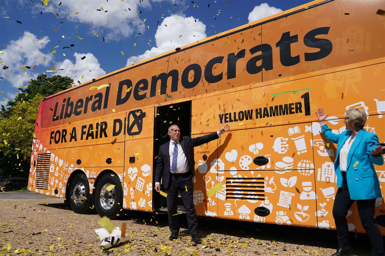 Liberal Democrat leader Sir Ed Davey, with local parliamentary candidate Pippa Heylings, at the launch of his party’s election battle bus at Whittlesford, Cambridge. on May 26 (Jacob King/PA)