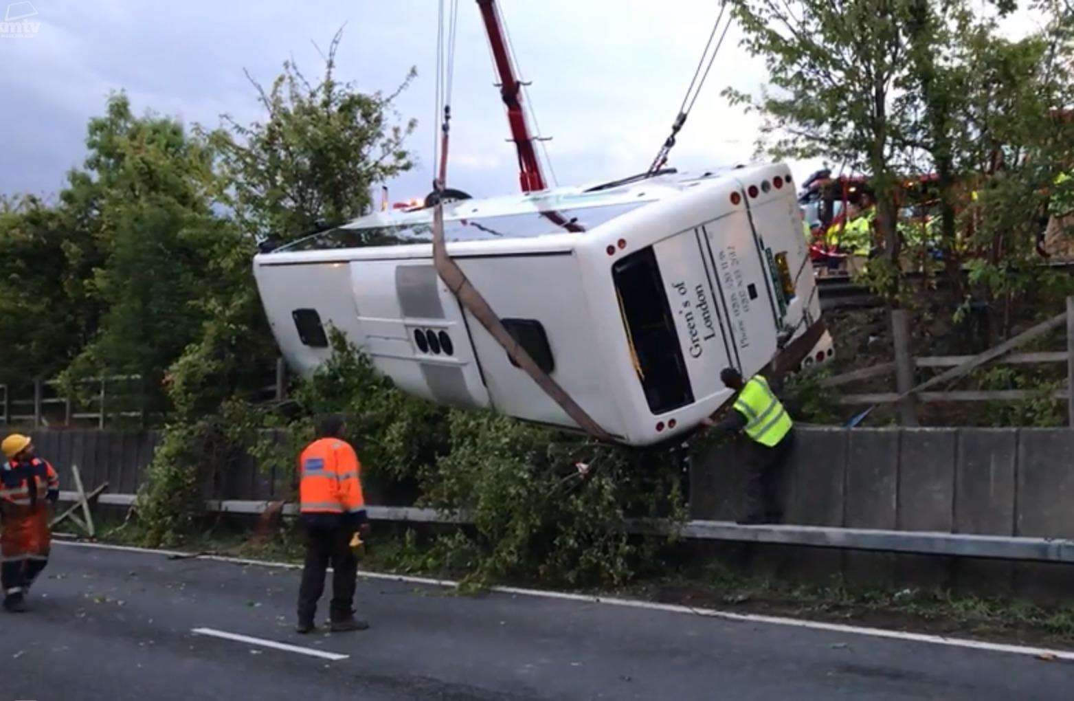 Emergency service workers recovering the overturned coach