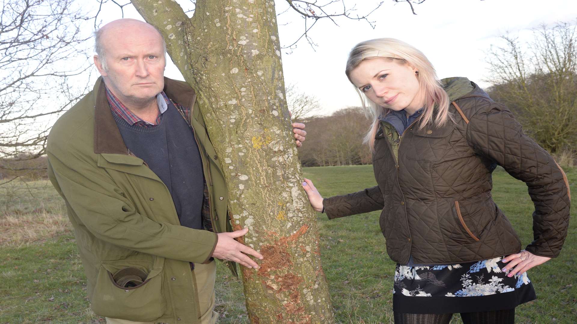 Cllr Ashley Clark and Anna Palmer, senior environment officer for Canterbury City Council with one of the trees damaged by a dog on Duncan Down. Picture: Chris Davey