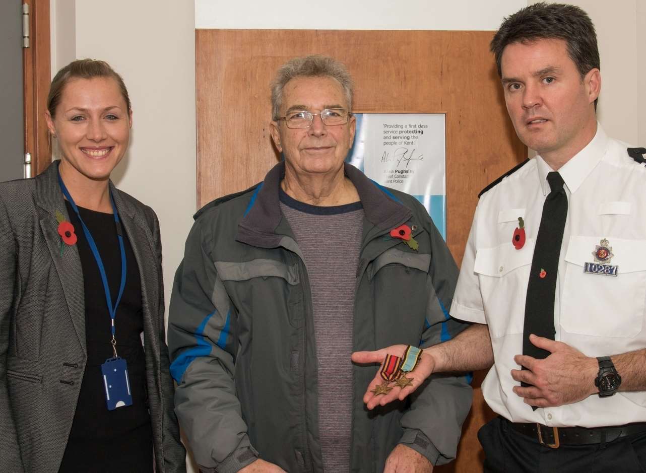 Det Sgt Steph Devon, Bryan Hall and Insp Kevin Stephens, returning Mr Hall's family medals