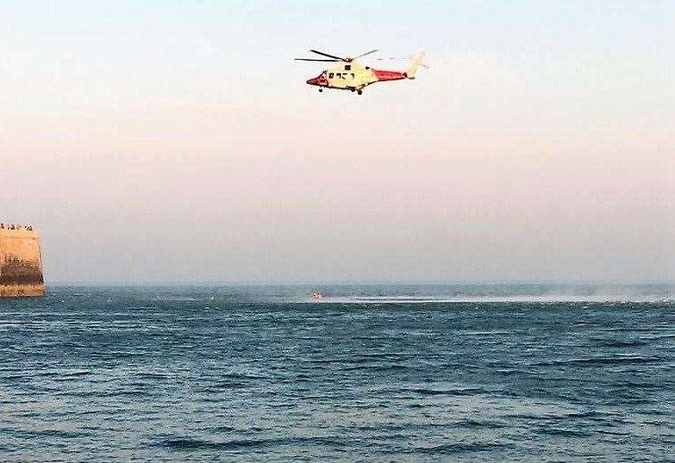 A man was airlifted out of the water at Folkestone after getting into difficulty. Picture: Folkestone Coastguard