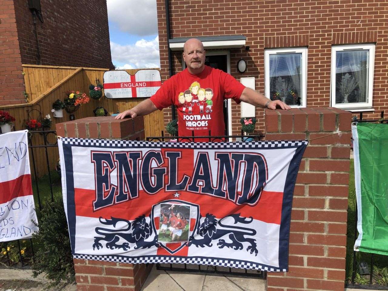 Peter Cowans, 64, with a display of flags outside his home in Ashington (Tom Wilkinson/PA)